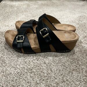 Dansko Black Buckle Wedge Sandals - Women